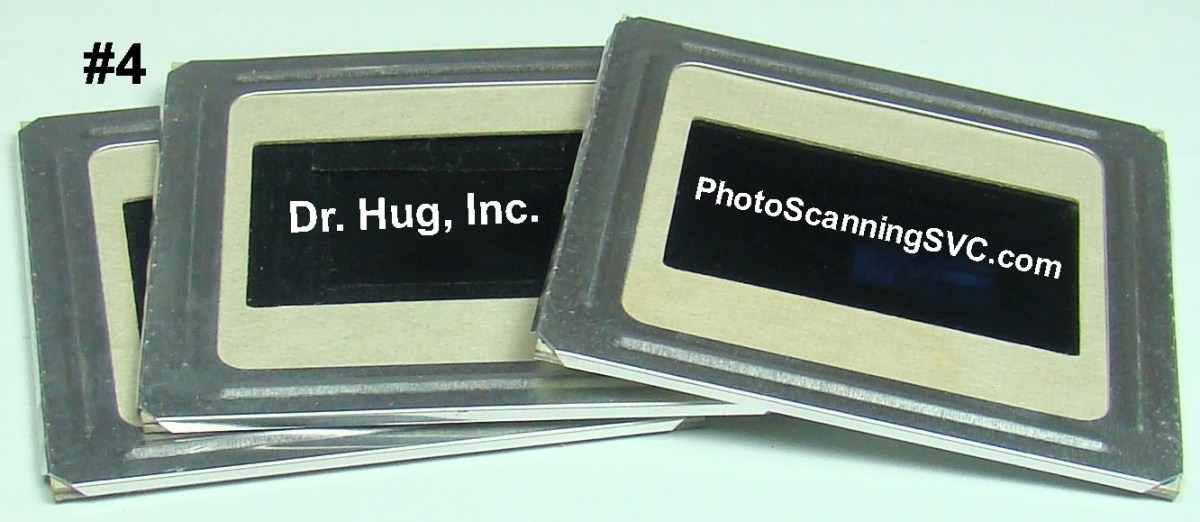 Photo of 2-inch x 2-inch photo slides with additional metal mounts (frames).